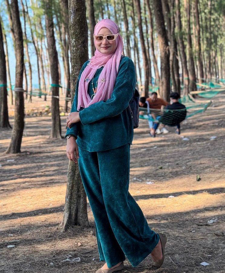 Shanila Jhumur working on a design project in her creative workspace